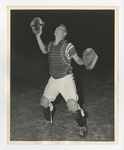 A photo of an umpire holding his mask and looking up by Lonnie W. Fleming Sr.
