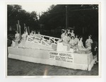 A group of nurses on a parade float by Lonnie W. Fleming Sr.