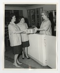 One woman giving two women a box by Lonnie W. Fleming Sr.