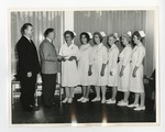 Two men presenting awards to nurses by Lonnie W. Fleming Sr.