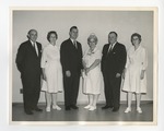 Three men in suits and three nurses posing for photo by Lonnie W. Fleming Sr.