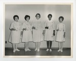 Five nurses posing while holding candles and certificates by Lonnie W. Fleming Sr.