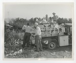 Four gentlemen unloading a truck full of boxes by Lonnie W. Fleming Sr.