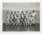 An integrated male basketball team posing for a team picture by Lonnie W. Fleming Sr.