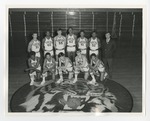 An integrated male basketball team posing for a team picture by Lonnie W. Fleming Sr.