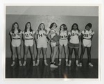 An integrated female basketball team posing for a team picture by Lonnie W. Fleming Sr.