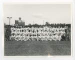 An integrated football team taking a team picture by Lonnie W. Fleming Sr.