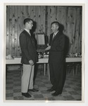 Bob Clark presenting a trophy to a student by Lonnie W. Fleming Sr.