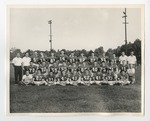A football team taking a group picture out on the field by Lonnie W. Fleming Sr.