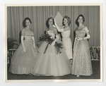Four women in dresses, with one crowning another by Lonnie W. Fleming Sr.