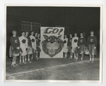 Cheerleaders lined up on either side of a "Go (Picture of Tiger" banner by Lonnie W. Fleming Sr.