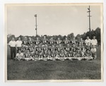A photo of a football team taking a team photo on the field by Lonnie W. Fleming Sr.
