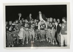 Football team holding up coaches on shoulders by Lonnie W. Fleming Sr.