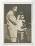 A suited gentleman crowning a Conway High School Homecoming Queen by Lonnie W. Fleming Sr.