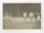 The number 51 and 20 players are seen shaking hands with other team by Lonnie W. Fleming Sr.