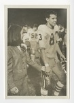 A photo of the number 83 player holding hands with a girl by Lonnie W. Fleming Sr.
