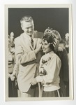 A suited gentleman crowning CHS Homecoming Queen by Lonnie W. Fleming Sr.