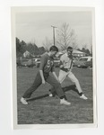 Two teenage boys walking in long strides and in unison by Lonnie W. Fleming Sr.