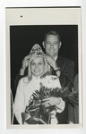 A suited gentleman crowning a blond cheerleader by Lonnie W. Fleming Sr.