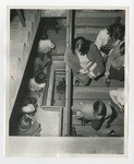 Students walking up and down a winding stairwell by Lonnie W. Fleming Sr.