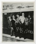 Four women posing in lockers by Lonnie W. Fleming Sr.