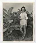 A woman standing by bush by Lonnie W. Fleming Sr.
