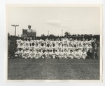 A group of football players taking a group photo in the field by Lonnie W. Fleming Sr.