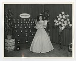 Miss South Carolina standing with a box and a cup by Lonnie W. Fleming Sr.