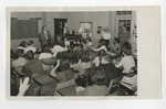 A teacher teaching a class of students by Lonnie W. Fleming Sr.