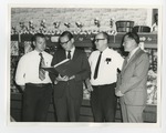 Frour men looking at a gsp folder by Lonnie W. Fleming Sr.