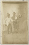 Dr. Joe Dusenberry's young helpers playing string instruments. by Horry County Historical Society