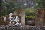 Small Ceramic Angels on the Graves by Emily Munn